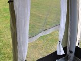 The awning's curtains come with solid rods and proper ties to keep them tidy