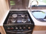 The four-burner hob sits above a Thetford Caprice oven and grill – read more in the Practical Caravan Coachman Vision 630 review