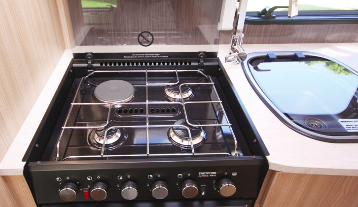 The four-burner hob sits above a Thetford Caprice oven and grill – read more in the Practical Caravan Coachman Vision 630 review