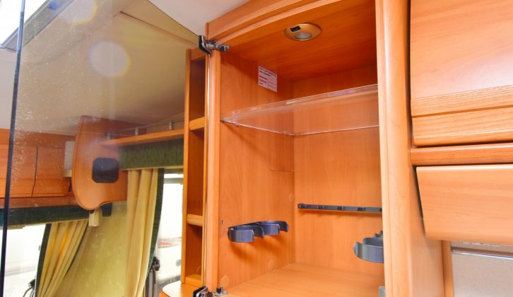 The drinks cabinet in this Swift caravan is swish, with a tinted Perspex door, and it also lights up for night-time use