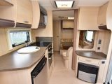 Worktop area is good in this used Sterling caravan, and there’s space and aerial and mains points on the dresser for a TV