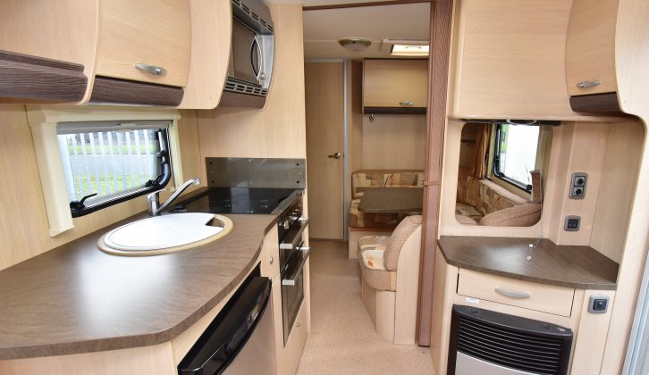 Worktop area is good in this used Sterling caravan, and there’s space and aerial and mains points on the dresser for a TV