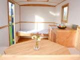 Solid oak window frames are an example of the high level of craftmanship evident in this bespoke caravan