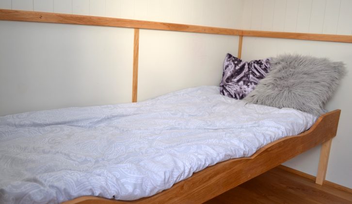 There's a single bed across the front of this example, again made from oak