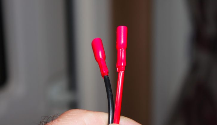 Female spade connectors were then attached to the new red and black cables