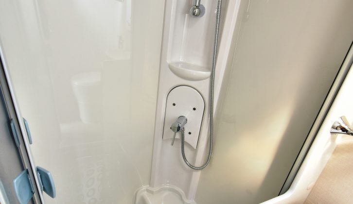 The shower cubicle is separate and comes with folding doors