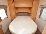 The end bedroom in the 545/4 is a good size and comes with plenty of storage, plus the mattress on this island bed looked little-used