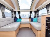 The superb, U-shaped front lounge of this Adria caravan is so spacious and gets a fold-up coffee table as standard