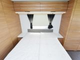 A window at the head of the bed as well as one on the opposite wall means the bedroom feels bright – storage is good, too