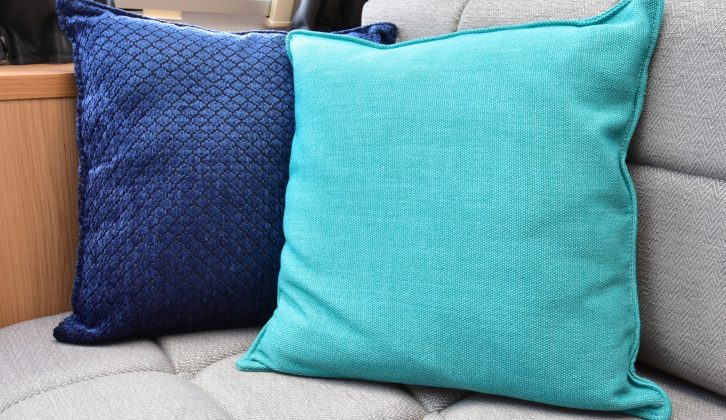 The scatter cushions aid comfort and add a welcome, modern pop of colour to the lounge