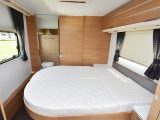 The transverse island bed in this Adria caravan measures 1.96m x 1.40m and has a split mattress