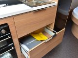 Three wide and deep drawers provide ample storage for pots and pans