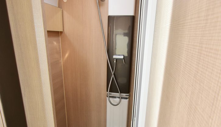 The shower doesn't have a moulded one-piece liner, but does have folding doors, a roof vent and a hanging rail