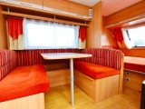 The side dinette turns into a double bed, while the Caravelair's cosy lounge area has a large side window