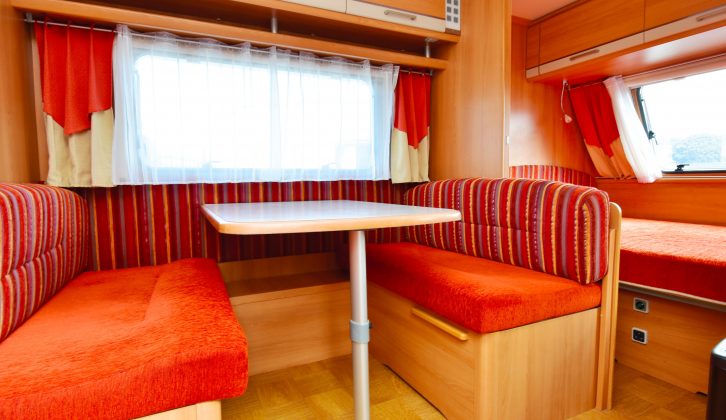 The side dinette turns into a double bed, while the Caravelair's cosy lounge area has a large side window