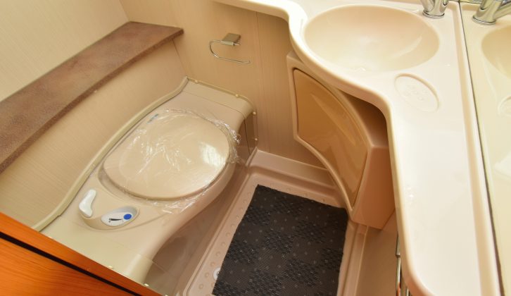 The washroom in the Caravelair is practical and has an electric-flush toilet