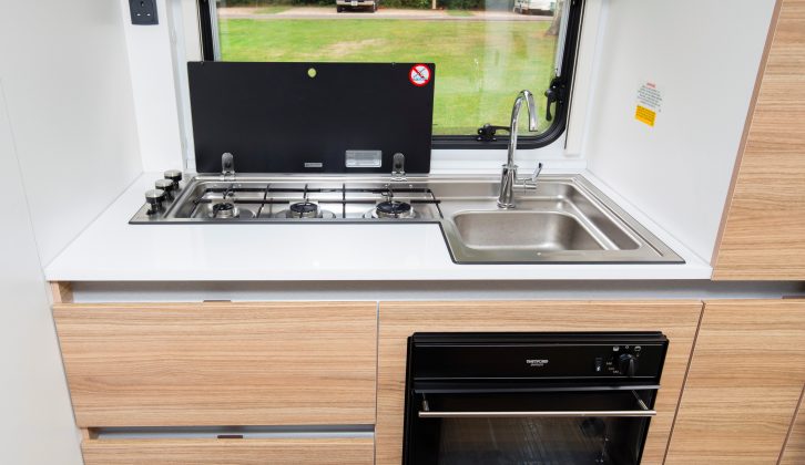 The end-kitchen in this Adria caravan may be compact, but it is well-equipped