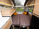 The 2.14m x 1.8m front double bed can accommodate three, while the 0.58m x 1.71m bunk has a 50kg weight limit