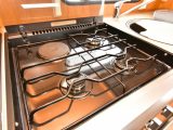 As well as the dual-fuel hob, the galley in this used Swift caravan has a separate oven and grill, plus a microwave