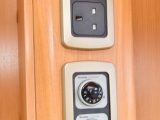 Two mains sockets and heating controls are handily positioned in the kitchen at the back of the dresser