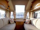 The Genoa is only a two-berth Bailey caravan, but it has a very generous and bright front lounge