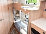 The fixed bunk beds measure 0.59m x 1.80m each, and each has a window, a curtain and excellent headroom – there's a fixed ladder and some storage space beneath