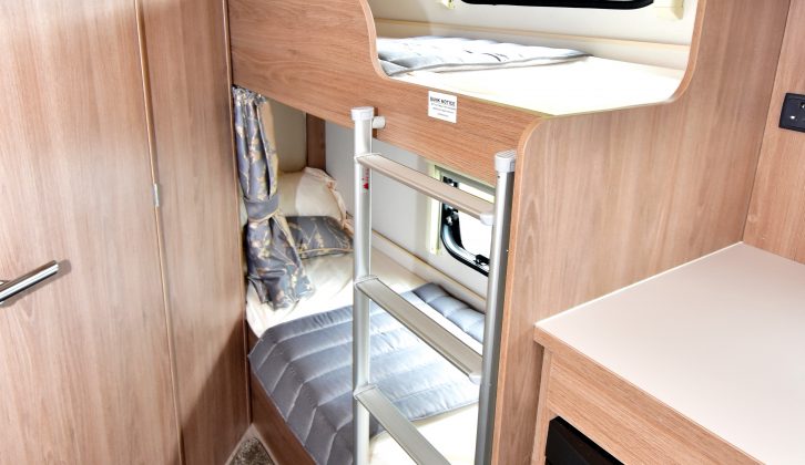 The fixed bunk beds measure 0.59m x 1.80m each, and each has a window, a curtain and excellent headroom – there's a fixed ladder and some storage space beneath