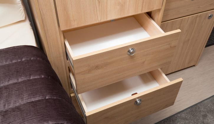 Each wardrobe has a pair of drawers beneath it