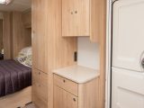Extra storage is opposite the kitchen, and this is a great place for your TV