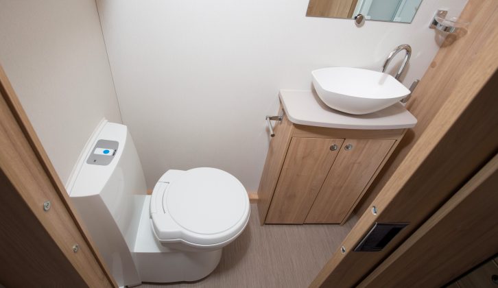 The end washroom has a smart sink and tap, but no window means it is a bit dark