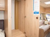 Wardrobes flank the Xplore 554's island bed – this one is the more spacious of the two, but the freestanding table is stowed here