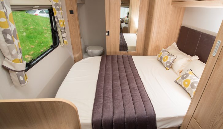 The island bed is 1.90m x 1.36m, while proper, lined curtains on a pole give a very domestic feel