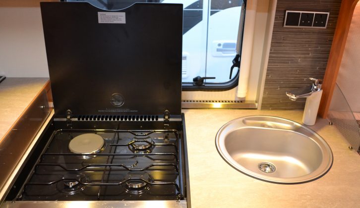 Kit-wise, the kitchen has a dual-fuel four-burner hob, an oven, a grill and a microwave