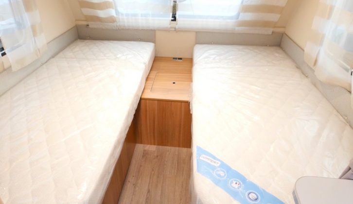 The generous fixed twin single beds at the front of the Caravelair Antarès 450 can also be made into a large double