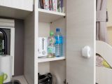 The floor-to-ceiling cupboard next to the kitchen is great for storing more than just food – read more in the Practical Caravan Caravelair Antarès 476 review