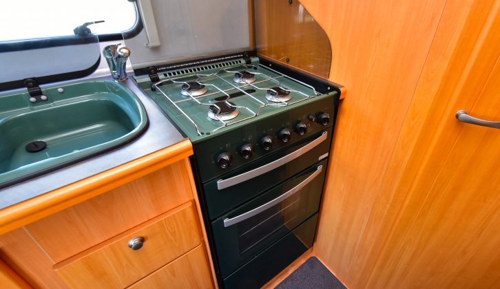 The side kitchen has a full oven and brilliant storage, but the green enamel sink looks very dated and can get scratched over time