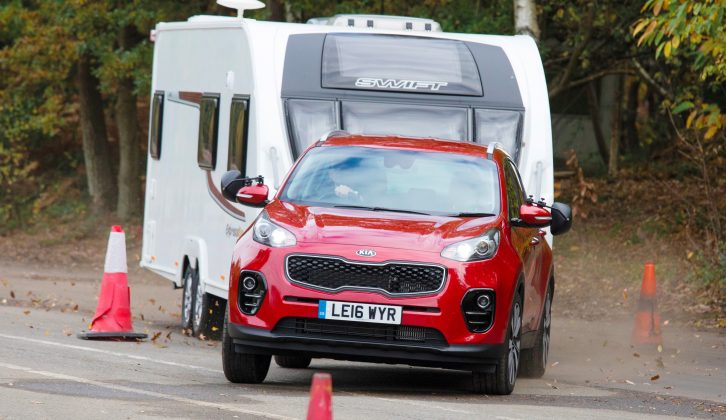 We pushed the Sportage hard in our lane-change test to truly determine what tow car ability it has