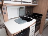 Even without an extension flap, there's a decent amount of food-preparation space in the kitchen of this Coachman caravan