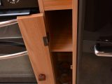 It might be a little tricky to get wine/drinks bottles in and out of this slender cupboard