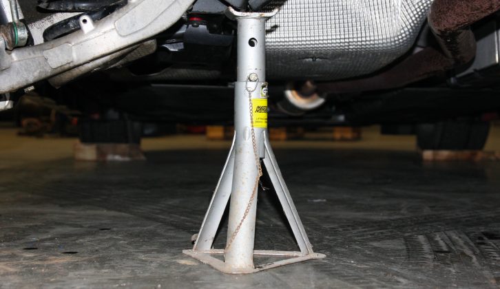 Support the rear of the car on suitably sturdy axle stands, using the designated points