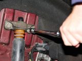 Replace the shock absorber upper mounting, and tighten to the correct torque setting