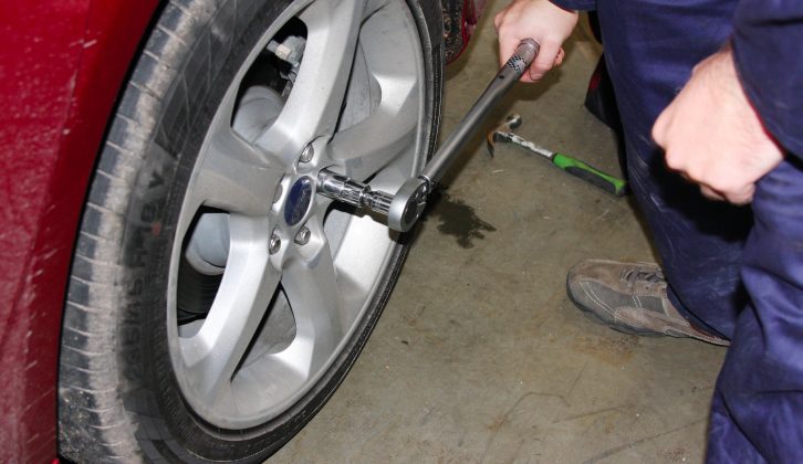 Replace wheels and nuts, lower car to the ground then tighten to the correct settings