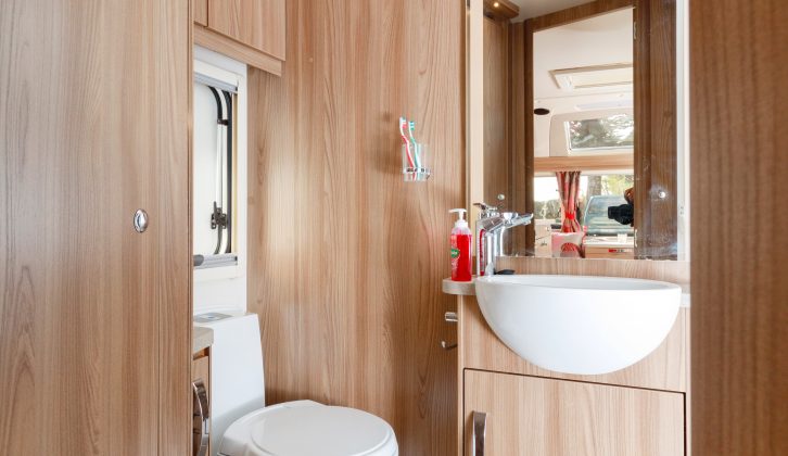 The mirror above the washbasin adds to the sense of space in what is actually quite a compact central washroom