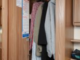 You'll also find the wardrobe in the washroom – it's not huge, but there is useful shelving underneath