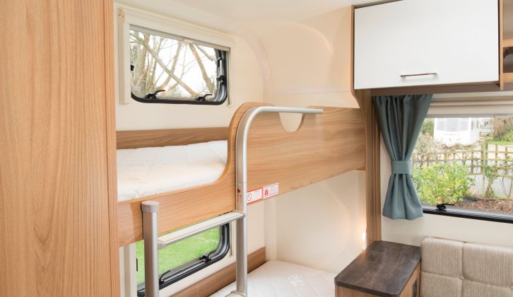 ￼Each of the good-sized fixed bunk beds gets a proper mattress, a reading light and a window, and there is a built-in ladder