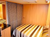 The long curtain helps you forget you're in a caravan, plus there's a large mirror and dresser, as well as neat ceiling lights