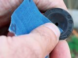 Remove the ‘glazing’ using fine emery paper or cloth, and then clean it using brake cleaner