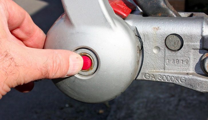 Replace the red plastic caps and return the washers to the right spots