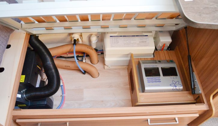 The offside seat base holds the consumer unit and water heater, but there is still space left to store some bedding