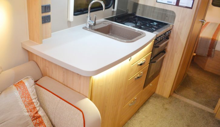 Two sockets extend the usefulness of the large work surface in the central kitchen –
 there’s a designer tap, too